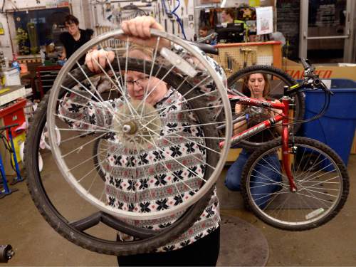 Al Hartmann  |  The Salt Lake Tribune
Apprentice Lisa Cook tears down a wheel during reconditioning of a donated bike during Women's Only night at Salt Lake Bicycle Collective. Women's Only night runs from 5:30 -9:00 pm on Wednesday nights where women can work on their own projects or recondition used bicycles.   The Salt Lake Bicycle Collective is at 2312 S. West Temple. The collective's mission is to promote cycling as sustainable transportation.  It provides refurbished bicycles for the community, especially for children and lower income households.