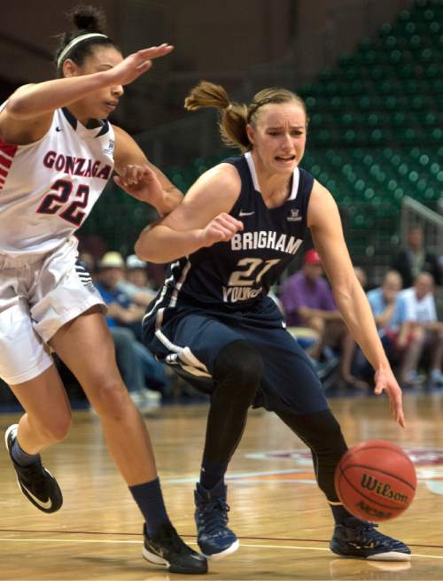 Rick Egan  |  The Salt Lake Tribune

Brigham Young Cougars guard Lexi Eaton (21) drives as Gonzaga Bulldogs forward Shaniqua Nilles (22) defends in the West Coast Conference Basketball Championships at the Orleans Arena in Las Vegas, Monday, March 9, 2015.