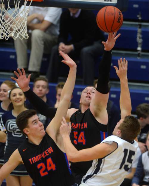 Steve Griffin  |  The Salt Lake Tribune


TImpview's Colson Santiago and AJ Bollinger team-up to block the shot of Corner Canyon's Trevor Miller as second-ranked Corner Canyon hosted No. 1 Timpview in a Region 7 boys' basketball game in Draper, Utah Tuesday, February 16, 2016.
