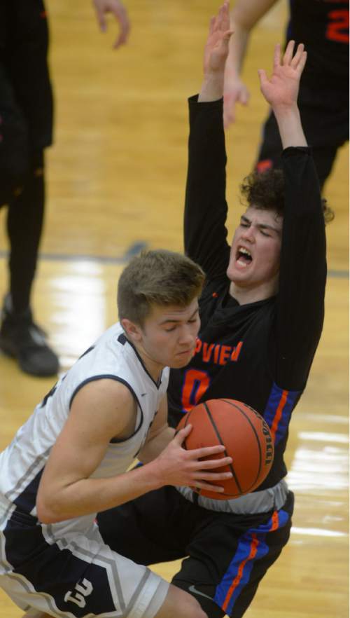 Steve Griffin  |  The Salt Lake Tribune


Corner Canyon's Braxton Coon crashes into Timpview's Adam Santaigo as second-ranked Corner Canyon hosted No. 1 Timpview in a Region 7 boys' basketball game in Draper, Utah Tuesday, February 16, 2016.