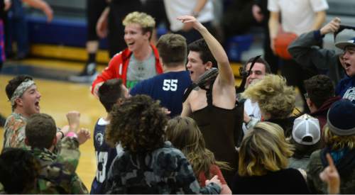 Steve Griffin  |  The Salt Lake Tribune


The student body rushes the court as  second-ranked Corner Canyon defeats No. 1 Timpview in a Region 7 boys' basketball game in Draper, Utah Tuesday, February 16, 2016.