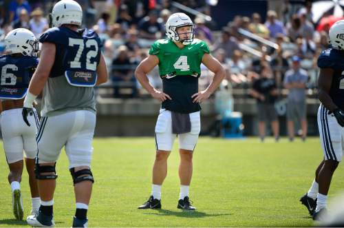 Scott Sommerdorf   |  The Salt Lake Tribune
BYU Quarterback Taysom Hill waits for the play call during practice, Saturday, August 22, 2015.