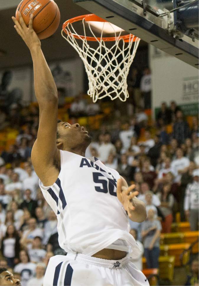 Rick Egan  |  The Salt Lake Tribune

Utah State Aggies forward Elston Jones (50) goes in for two points, in college basketball action, Utah State Aggies vs. The Colorado State Rams, at the Dee Glen Smith Spectrum in Logan,  Wednesday, February 17, 2016.