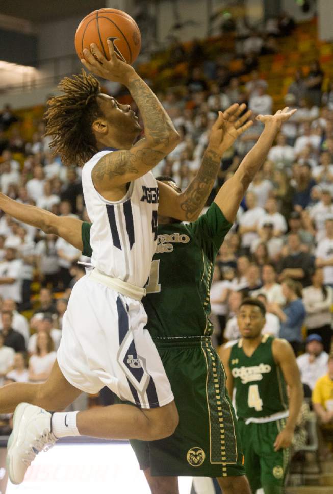 Rick Egan  |  The Salt Lake Tribune

Utah State Aggies guard Shane Rector (4) takes the ball in for a lay-up, in college basketball action, Utah State Aggies vs. The Colorado State Rams, at the Dee Glen Smith Spectrum in Logan,  Wednesday, February 17, 2016.