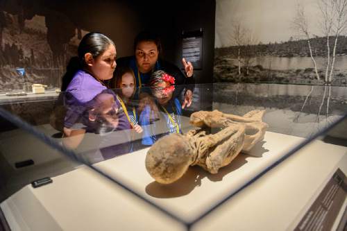 Trent Nelson  |  The Salt Lake Tribune
Kids from the Capitol West Boys & Girls Club look over the remains of the remains of a female mummy from Peru, at The Leonardo's Mummies of the World: The Exhibition in Salt Lake City, Wednesday February 17, 2016.