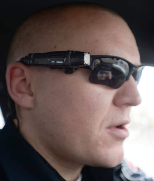 Steve Griffin  |  The Salt Lake Tribune

West Valley City Police officer Skyler Denning wears his new body camera, for the first time, on his sun glasses, in West Valley City, Monday, March 2, 2015. When switched on the camera is continually buffering video.