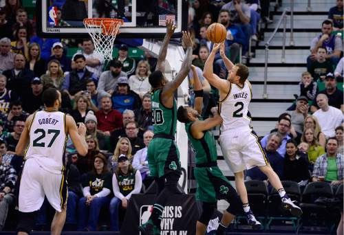 Scott Sommerdorf   |  The Salt Lake Tribune
Utah's Joe Ingles shoots over Boston's Amir Johnson during first half play. The Utah Jazz led the Boston Celtics 54-49 at the half, Friday, February 19, 2016.