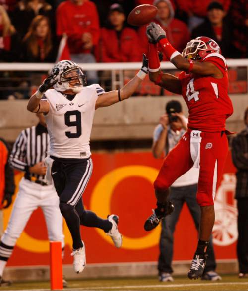 Trent Nelson  |  The Salt Lake Tribune

BYU wide receiver Austin Collie (9) is defended by Utah's Sean Smith on an incomplete pass during the Utah BYU game Saturday November 22, 2008.