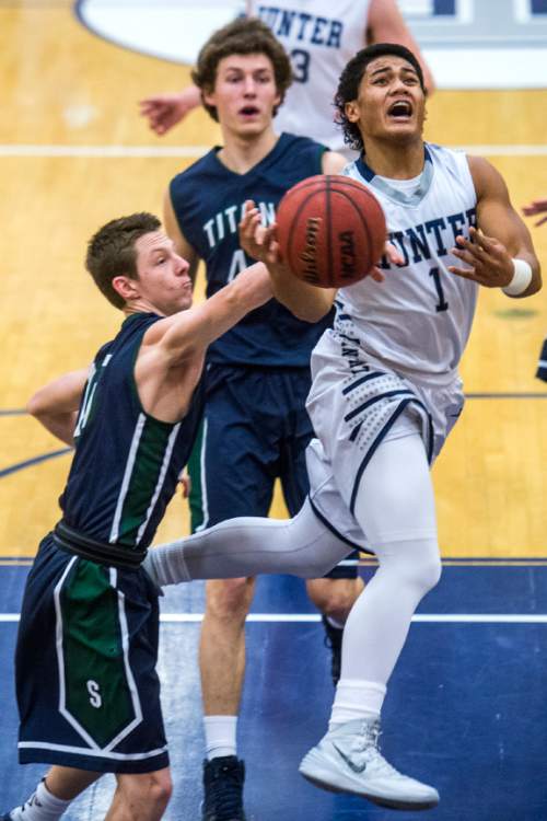 Chris Detrick  |  The Salt Lake Tribune
Hunter's Olson Williams (1) shoots past during the game at Hunter High School Friday February 19, 2016. Syracuse defeated Hunter 57-51.