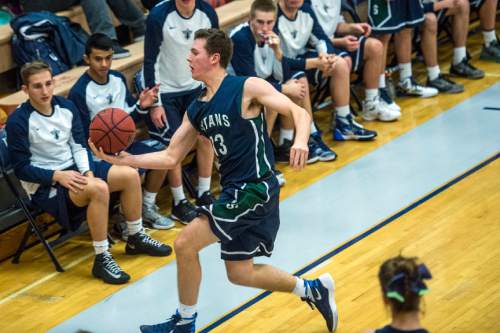 Chris Detrick  |  The Salt Lake Tribune
Syracuse's Drew Carlson (13) saves the ball from going out of bounds during the game at Hunter High School Friday February 19, 2016. Syracuse defeated Hunter 57-51.