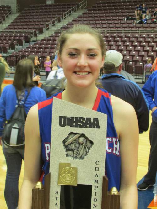 Tom Wharton  |  The Salt Lake Tribune

Panguitch star Chesney Campbell, who scored 12 points in state title game, clutches title trophy after Bobcats beat Duchesne.