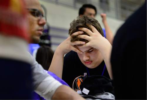 Scott Sommerdorf   |  The Salt Lake Tribune
Skyler Hughes of Ogden High listens to music as their team brainstorms their approach to the next challenge during the lunch break at Utah's 2016 FIRST Tech Challenge at Weber State University in Ogden, Saturday, February 20, 2016.