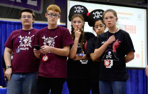 Scott Sommerdorf   |  The Salt Lake Tribune
Jackie Hall, center, nervously watches as the Avenues Team's robot "Roger" gets stranded during it's competition at Utah's 2016 FIRST Tech Challenge at Weber State University in Ogden, Saturday, February 20, 2016.