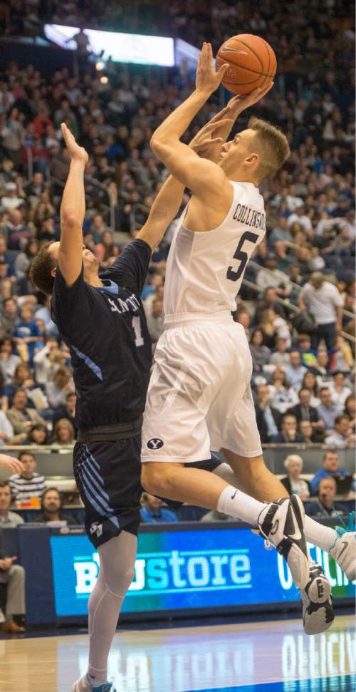 Rick Egan  |  The Salt Lake Tribune

Brigham Young Cougars guard Kyle Collinsworth (5) shoots over San Diego Toreros guard Tyler Williams (1), in WCC basketball action, The Brigham Young Cougars vs. The San Diego Toreros, at the Marriott Center in Provo Saturday, February 20, 2016.