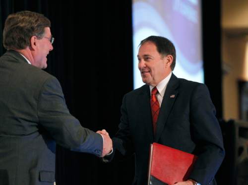 Al Hartmann  |  The Salt Lake Tribune
Scott Anderson, President and CEO of Zions Bank, left, greets Utah Governor Gary Herbert before speaking at the annual Zions Bank Trade and Business Conference in Salt Lake City Wednesday May 23.