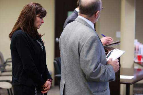Susan Hunt stands behind her defense attorney, Ron Yengich, right, in court in Saratoga Springs on Friday, Jan. 23, 2014. Susan Hunt, mother of Darrien Hunt, who was shot and killed by Saratoga Springs police while carrying a sword in September, is facing misdemeanor charges stemming from a reported confrontation she had with officers from that police department in October. SPENSER HEAPS, Daily Herald