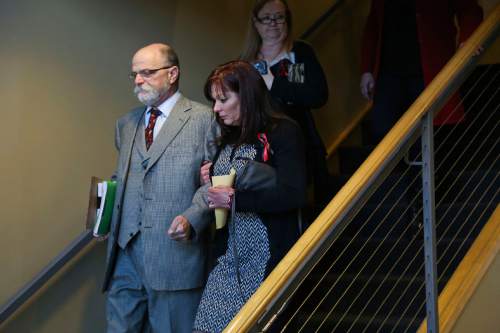 Susan Hunt walks with her defense attorney, Ron Yengich, after appearing in court in Saratoga Springs on Friday, Jan. 23, 2014. Susan Hunt, mother of Darrien Hunt, who was shot and killed by Saratoga Springs police while carrying a sword in September, is facing misdemeanor charges stemming from a reported confrontation she had with officers from that police department in October. SPENSER HEAPS, Daily Herald