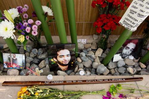 Trent Nelson  |  The Salt Lake Tribune
Photos, notes, flowers and a wooden sword at a memorial to Darrien Hunt Sunday September 14, 2014 at the Saratoga Springs Panda Express, where Hunt was shot and killed by police.