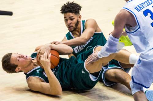Chris Detrick  |  The Salt Lake Tribune
UVU forward Konner Frey (11) and UVU guard Telly Davenport (3) fight for a rebound resulting in a travel charge during the game at the Marriott Center Friday November 13, 2015.