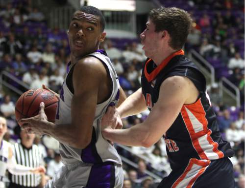 Rick Egan  | The Salt Lake Tribune 

Weber State Wildcats forward Joel Bolomboy (21) works on Idaho State Bengals guard/forward Chris Hansen (20), in basketball action at the Dee Event Center in Ogden, Monday, February 11, 2013.