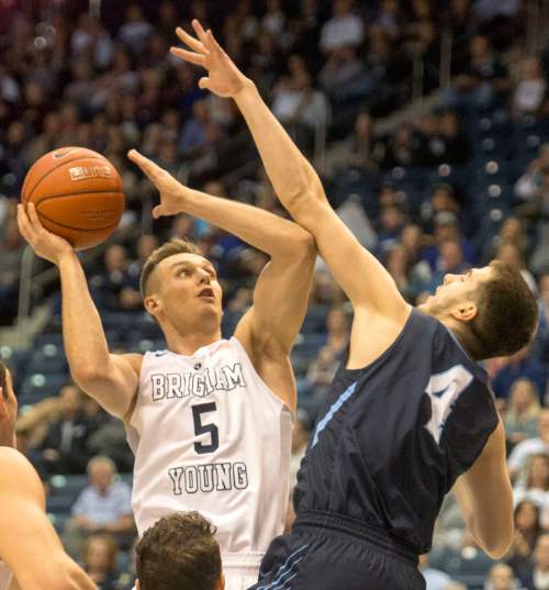 Rick Egan  |  The Salt Lake Tribune

Brigham Young Cougars guard Kyle Collinsworth (5) shoots over San Diego Toreros guard Vasa Pusica (4), in WCC basketball action, The Brigham Young Cougars vs. The San Diego Toreros, at the Marriott Center in Provo Saturday, February 20, 2016.