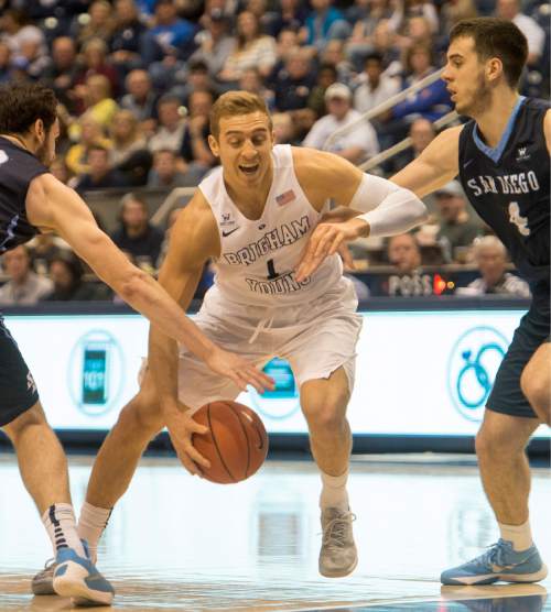 Rick Egan  |  The Salt Lake Tribune

Brigham Young Cougars guard Chase Fischer (1)  dribbles past  San Diego Toreros guard Vasa Pusica (4), in WCC basketball action, The Brigham Young Cougars vs. The San Diego Toreros, at the Marriott Center in Provo Saturday, February 20, 2016.