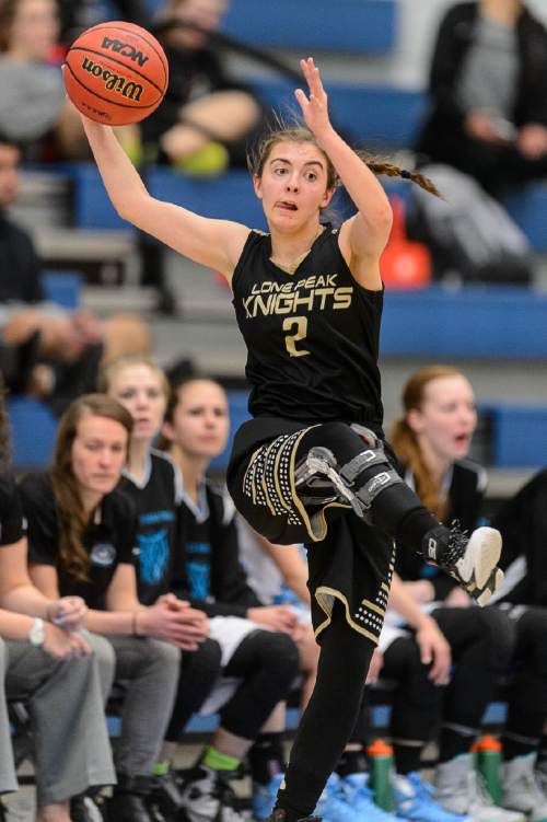 Trent Nelson  |  The Salt Lake Tribune
Lone Peak's Savannah Flanary makes a save as the ball flies out of bounds as Sky View faces Lone Peak in a first round game at the 5A High School Girls Basketball Tournament at Salt Lake Community College in Taylorsville, Tuesday February 23, 2016.