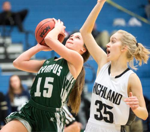 Rick Egan  |  The Salt Lake Tribune

Olympus Titans guard Samantha Sheets (15) scores as Highland Rams guard Cecilia Foster (15) defends, in State Basketball Playoff action, The Highland Rams vs. The Olympus Titans, in Taylorsville, February 22, 2016.