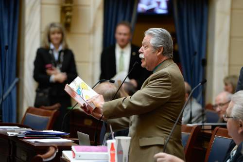 Francisco Kjolseth  |  The Salt Lake Tribune 
Senator Gene Davis, D-Salt Lake, takes a turn reading Green Eggs and Ham as the Cat in the Hat visits the Utah Capitol on Friday, Feb. 27, 2015.