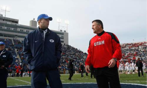 Chris Detrick | The Salt Lake Tribune

BYU head coach Bronco Mendenhall and Utah head coach Kyle Whittingham meet at the center of the field before the start of the 2009 rivalry game in Provo.