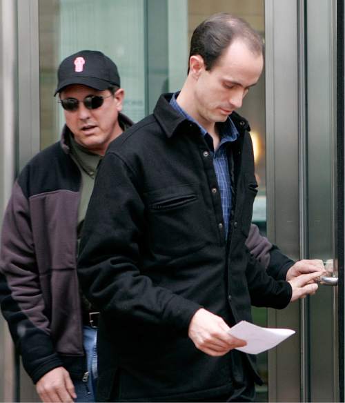 Seth Steed Jeffs, 32, right, of Hildale, Utah, leaves the federal courthouse in Denver with his brother Lyle, Thursday, Nov. 17, 2005, after entering a plea of not guilty on charges of concealing his brother, fugitive polygamist sect leader Warren Steed Jeffs. Seth Jeffs was arrested after a traffic stop Oct. 28 in Pueblo County south of Denver. Authorities said he had nearly $142,000 in cash, about $7,000 worth of prepaid debit and phone cards and Warren Jeffs' personal papers in his SUV. (AP Photo/Ed Andrieski)
