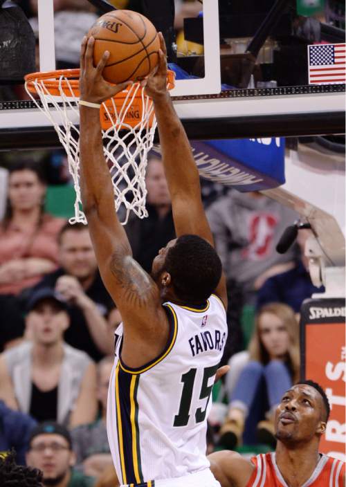 Steve Griffin  |  The Salt Lake Tribune


Utah Jazz forward Derrick Favors (15) dunks the ball over Houston Rockets center Dwight Howard (12) after scooping up an offensive rebound late in the fourth quarter during the Utah Jazz versus Houston Rockets game at Vivint Smart Home Arena in Salt Lake City, Tuesday, February 23, 2016.