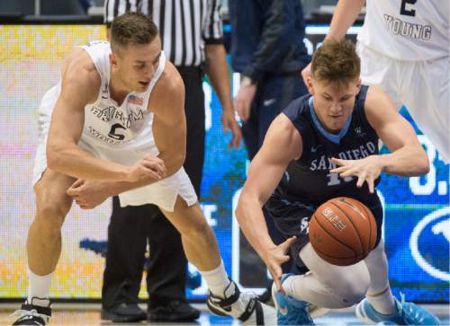 Rick Egan  |  The Salt Lake Tribune

Brigham Young Cougars guard Kyle Collinsworth (5) tips the ball away from San Diego Toreros forward Alex Floresca (15), in WCC basketball action, The Brigham Young Cougars vs. The San Diego Toreros, at the Marriott Center in Provo Saturday, February 20, 2016.