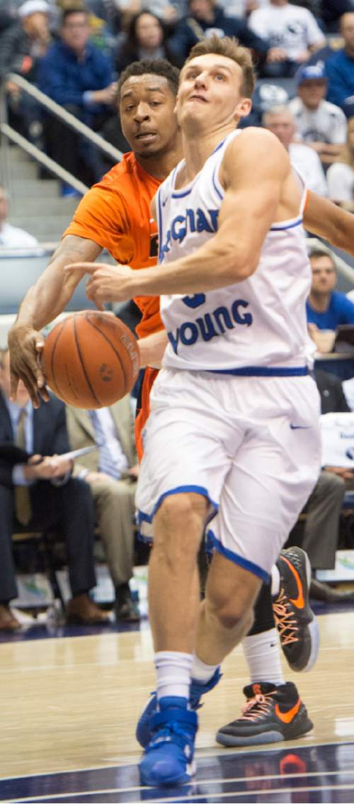 Rick Egan  |  The Salt Lake Tribune

Brigham Young Cougars guard Kyle Collinsworth (5) has the ball stripped by Pacific Tigers guard Ray Bowles (22) in WCC basketball action, Brigham Young Cougars vs. The Pacific Tigers, Saturday, February 6, 2016.