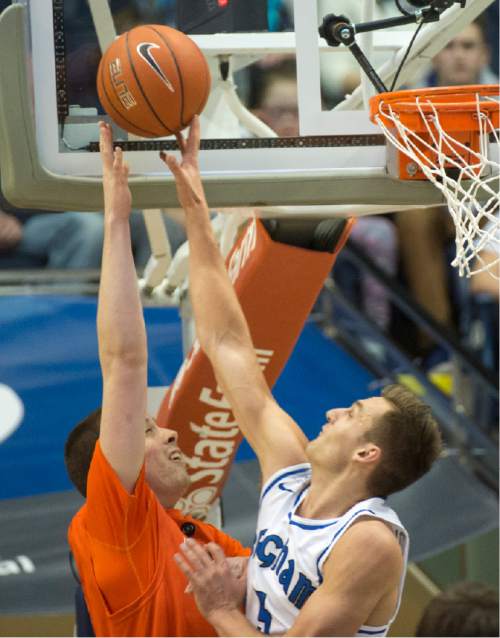 Rick Egan  |  The Salt Lake Tribune

Brigham Young Cougars guard Kyle Collinsworth (5) blocks a shot by Pacific Tigers forward Jacob Lampkin (21), in WCC basketball action, Brigham Young Cougars vs. The Pacific Tigers, Saturday, February 6, 2016.