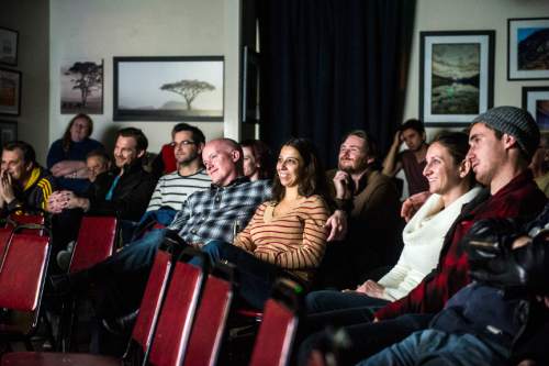 Chris Detrick  |  The Salt Lake Tribune
People watch the animated series "Looney Moonies" at Mod a-go-go in Salt Lake City on Thursday, Feb. 18, 2016.  The series is part of a Utah-based "Name the Moon" online campaign to gather signatures and petition the International Astronomical Union to give the moon a unique name.