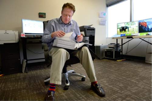Scott Sommerdorf   |  The Salt Lake Tribune
Jeremy Johnson - ensconced in this office preparing for his trial, Thursday, February 4, 2016. He and and two others go on trial Monday, on 86 federal charges.