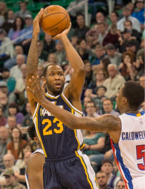 Rick Egan  |  The Salt Lake Tribune

Utah Jazz forward Chris Johnson (23) takes a shot, as Detroit Pistons guard Kentavious Caldwell-Pope (5) defends,  in NBA action, The Utah Jazz vs. The Detroit Pistons, in Salt Lake City, Monday, January 25, 2016.