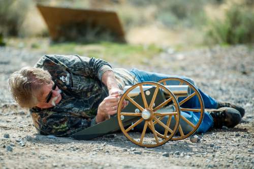 Chris Detrick  |  The Salt Lake Tribune
Robert Kirby aims a pool ball cannon at a clothes washer in Rush Valley in 2015.