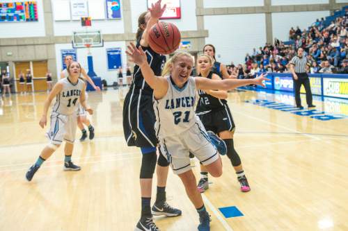 Chris Detrick  |  The Salt Lake Tribune
Pleasant Grove's Sara Hamson (22) fouls Layton's Clara Wood (21) during the 5A girls' basketball quarterfinals at Salt Lake Community College Thursday February 25, 2016. Layton won the game 54-37.