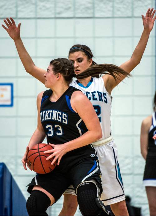 Chris Detrick  |  The Salt Lake Tribune
Layton's Livia Borges (22) guards Pleasant Grove's Sadie Nixon (33) during the 5A girls' basketball quarterfinals at Salt Lake Community College Thursday February 25, 2016. Layton won the game 54-37.