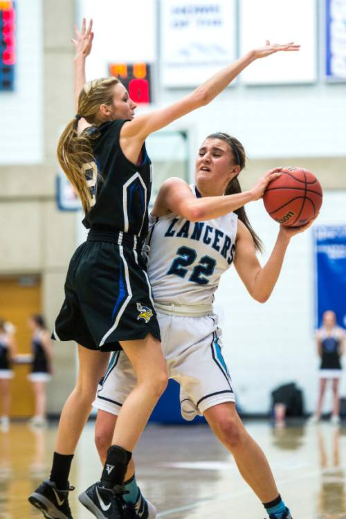 Chris Detrick  |  The Salt Lake Tribune
Pleasant Grove's Emilee Anderson (2) guards Layton's Livia Borges (22) during the 5A girls' basketball quarterfinals at Salt Lake Community College Thursday February 25, 2016. Layton won the game 54-37.