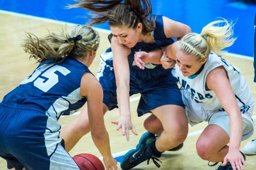 Chris Detrick  |  The Salt Lake Tribune
Copper Hills's Shirsten Wissinger (35) Copper Hills's Mikelle Magalogo (22) and Layton's Clara Wood (21)  go for the ball during the 5A girls' basketball semifinals at Salt Lake Community College Friday February 26, 2016. Layton defeated Copper Hills 46-44 in overtime.