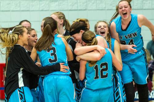 Chris Detrick  |  The Salt Lake Tribune
Members of the Sky View basketball team celebrate after winning the 5A girls' basketball semifinals at Salt Lake Community College Friday February 26, 2016. Sky View defeated American Fork 63-55.