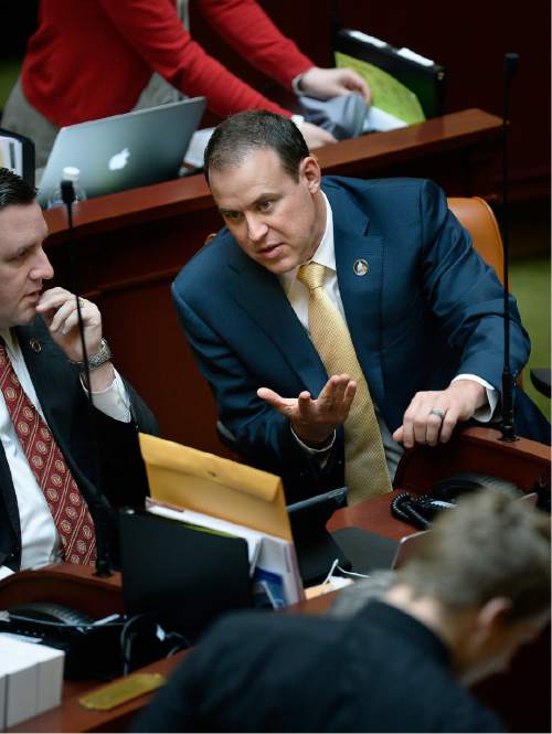 Scott Sommerdorf   |  The Salt Lake Tribune
Rep. Mike Schultz, R-Hooper, right, leans in to speak with Rep. Robert Spendlove, R-Sandy, in the Utah House of Representatives, Wednesday, January 28, 2015.