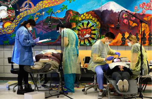 Scott Sommerdorf   |  The Salt Lake Tribune  
Dental students work on some of the approximately 200 patients served at the semi-annual free dental fair at Horizonte organized by the Junior League of Salt Lake City, Saturday, February 27, 2016.