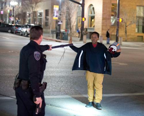 Lennie Mahler  |  The Salt Lake Tribune
Police stop Selam Mohammad as the 19-year-old walked away from a crowd that formed after an officer-involved shooting at 200 South Rio Grande Street in Salt Lake City on Saturday.