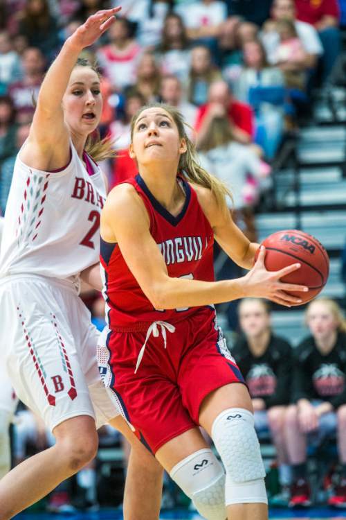 Chris Detrick  |  The Salt Lake Tribune
Springville's Savannah Sumsion (10) shoots past Bountiful's Kennedy Redding (24) during the 4A girls' basketball championships at Salt Lake Community College Saturday February 27, 2016.