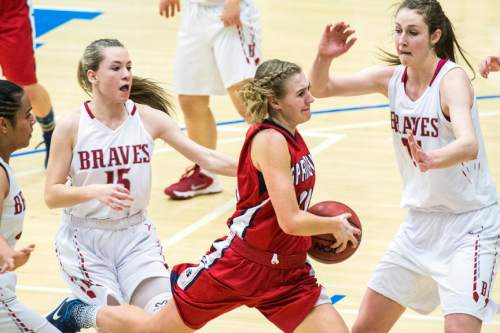 Chris Detrick  |  The Salt Lake Tribune
Springville's Ali Monson (11) runs past Bountiful's Jaimee Stahle (15) and Bountiful's Kennedy Redding (24) during the 4A girls' basketball championships at Salt Lake Community College Saturday February 27, 2016.