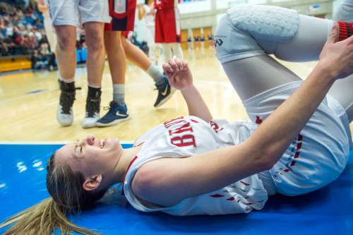 Chris Detrick  |  The Salt Lake Tribune
Bountiful's Jaimee Stahle (15) falls to the floor after colliding with Springville's Savannah Sumsion (10) during the 4A girls' basketball championships at Salt Lake Community College Saturday February 27, 2016. Bountiful defeated Springville 63-42.